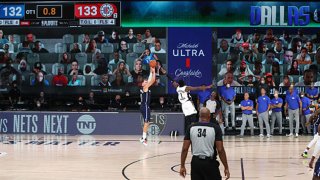 Luka Doncic #77 of the Dallas Mavericks hits the game-winning three-pointer in overtime against the LA Clippers during Round One, Game Four of the NBA Playoffs on Aug. 23, 2020 at the AdventHealth Arena at ESPN Wide World Of Sports Complex in Orlando, Florida.