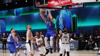 Kristaps Porzingis #6 of the Dallas Mavericks shoots the ball against the LA Clippers during Round One, Game One of the NBA Playoffs on Aug. 21, 2020 in Orlando, Florida at AdventHealth Arena.