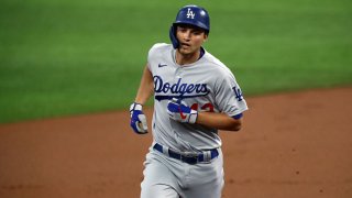 Corey Seager #42 of the Los Angeles Dodgers runs the bases after hitting a home run against the Texas Rangers in the first inning at Globe Life Field on Aug. 30, 2020 in Arlington, Texas. All players are wearing #42 in honor of Jackie Robinson Day. The day honoring Jackie Robinson, traditionally held on April 15, was rescheduled due to the COVID-19 pandemic.