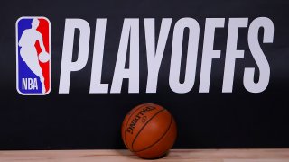 A basketball sits next to an NBA Playoffs logo in Game Five of the Eastern Conference First Round scheduled between the Milwaukee Bucks and the Orlando Magic during the 2020 NBA Playoffs at AdventHealth Arena at ESPN Wide World Of Sports Complex on August 26, 2020 in Lake Buena Vista, Florida. NOTE TO USER: User expressly acknowledges and agrees that, by downloading and or using this photograph, User is consenting to the terms and conditions of the Getty Images License Agreement. (Photo by Kevin C. Cox/Getty Images)