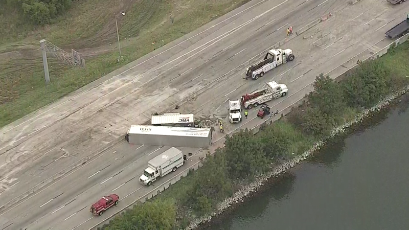 Two overturned 18-wheelers on the I-30 bridge over Lake Ray Hubbard