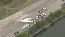 Two overturned 18-wheelers closed the I-30 bridge over Lake Ray Hubbard Monday morning.