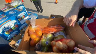 An image from the Tarrant Area Food Bank hosting their Mega Mobile Market, distributing food to families in need.