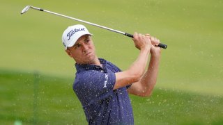 Justin Thomas, of the United States, plays a shot from a bunker on the 17th hole during the first round of the US Open Golf Championship