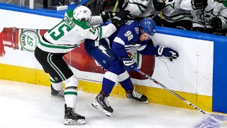 Mikhail Sergachev #98 of the Tampa Bay Lightning is checked by Blake Comeau #15 of the Dallas Stars during the first period in Game Two of the 2020 NHL Stanley Cup Final at Rogers Place on Sept. 21, 2020 in Edmonton, Alberta, Canada.