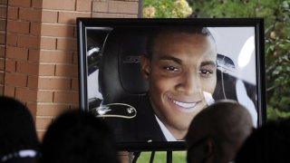 HFM*A photograph of Army veteran Damian Daniels is displayed before mourners during his funeral at Alabama National Cemetery in Montevallo, Ala., on Friday, Sept. 11, 2020. Daniels, an Alabama native who served in Afghanistan, was fatally shot by a sheriff’s deputy at his home in San Antonio, Texas, last month. Relatives say he was troubled mentally.