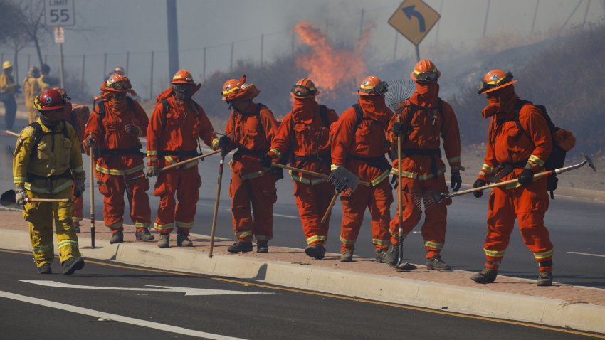 Inmate firefighters work to contain the Easy Fire in Simi Valley, California