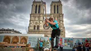 Members of the Charpentiers sans Frontièrs (Carpenters without Borders) work to reconstruct one of the missing timber frames of Notre-Dame Cathedral that was destroyed by the fire using traditional methods in front of the Cathedral on Sept. 19, 2020 in Paris, France. Part of the 37th edition of the European Heritage Days, the iconic Parisian landmark aims at informing the public of the reconstruction plans related to the April 15, 2019 fire and aims to improve the public’s knowledge of Notre-Dame’s architecture and history. The extensive damage to the roof and spire of the 13th-century Notre Dame de Paris cathedral have proven reconstruction process to be much more complex than many anticipated.