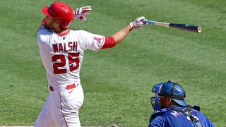 Jared Walsh #25 of the Los Angeles Angels hits a grand slam home run in the fourth inning against the Texas Rangers at Angel Stadium of Anaheim on Sept. 21, 2020 in Anaheim, California.