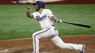 Jeff Mathis #2 of the Texas Rangers hits a three-run home run against the Houston Astros in the seventh inning at Globe Life Field on Sept. 26, 2020 in Arlington, Texas.