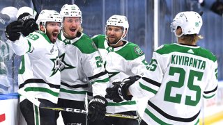 Joel Hanley #39 of the Dallas Stars celebrates with Roope Hintz #24, Joel Kiviranta #25 and Andrej Sekera #5 after Hanley scored in the first period of Game One of the NHL Stanley Cup Final between the Dallas Stars and the Tampa Bay Lightning at Rogers Place on Sept. 19, 2020 in Edmonton, Alberta, Canada.