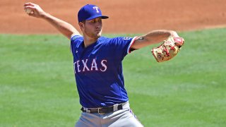 Kyle Cody #73 of the Texas Rangers pitches in the first inning against the Los Angeles Angels at Angel Stadium of Anaheim on Sept. 20, 2020 in Anaheim, California.