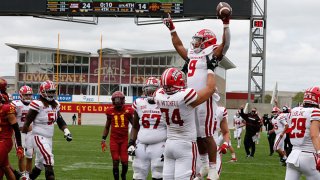 Running back Trey Ragas #9 of the Louisiana-Lafayette Ragin Cajuns is lifted into the air by teammate offensive lineman Max Mitchell #74 of the Louisiana-Lafayette Ragin Cajuns after he scored a touchdown in the second half of the play against the Iowa State Cyclones at Jack Trice Stadium on Sept. 12, 2020 in Ames, Iowa. The Louisiana-Lafayette Ragin Cajuns won 31-14 over the Iowa State Cyclones.