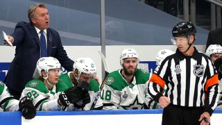 Head coach Rick Bowness of the Dallas Stars speaks from behind the bench during the first period of Game Two of the NHL Stanley Cup Final between the Dallas Stars and the Tampa Bay Lightning at Rogers Place on Sept. 21, 2020 in Edmonton, Alberta, Canada.