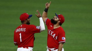 Elvis Andrus #1 and Rougned Odor #12 of the Texas Rangers celebrate a 5-2 win against the Oakland Athletics at Globe Life Field on Sept. 12, 2020 in Arlington, Texas.