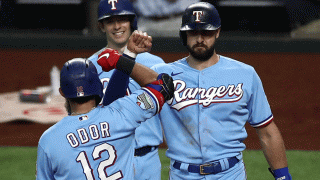 Rougned Odor #12 of the Texas Rangers celebrates a three-run home run with Joey Gallo #13 and Nick Solak #15 against the Houston Astros in the fourth inning at Globe Life Field on Sept. 27, 2020 in Arlington, Texas.