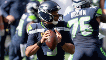 Russell Wilson #3 of the Seattle Seahawks looks to throw a pass against the Dallas Cowboys during the first quarter in the game at CenturyLink Field on Sept. 27, 2020 in Seattle, Washington.