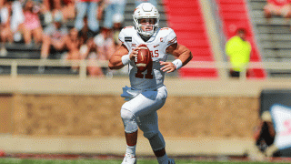 Quarterback Sam Ehlinger #11 of the Texas Longhorns scrambles during the first half of the college football game against the Texas Tech Red Raiders on Sept. 26, 2020 at Jones AT&T Stadium in Lubbock, Texas.