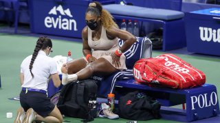 Serena Williams of the United States has her ankle retaped in the third set during her Women's Singles semifinal match against Victoria Azarenka of Belarus on Day Eleven of the 2020 US Open at the USTA Billie Jean King National Tennis Center on September 10, 2020, in the Queens borough of New York City.