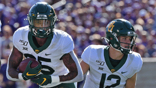 FILE - Running back Trestan Ebner #25 of the Baylor Bears turns up field with the ball against the Kansas State Wildcats during the first half at Bill Snyder Family Football Stadium on Oct. 5, 2019 in Manhattan, Kansas.