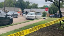 Police crime scene tape surrounds the car that was reported stolen early Wednesday morning with a 3-year-old girl inside, who was later found safe by officers.