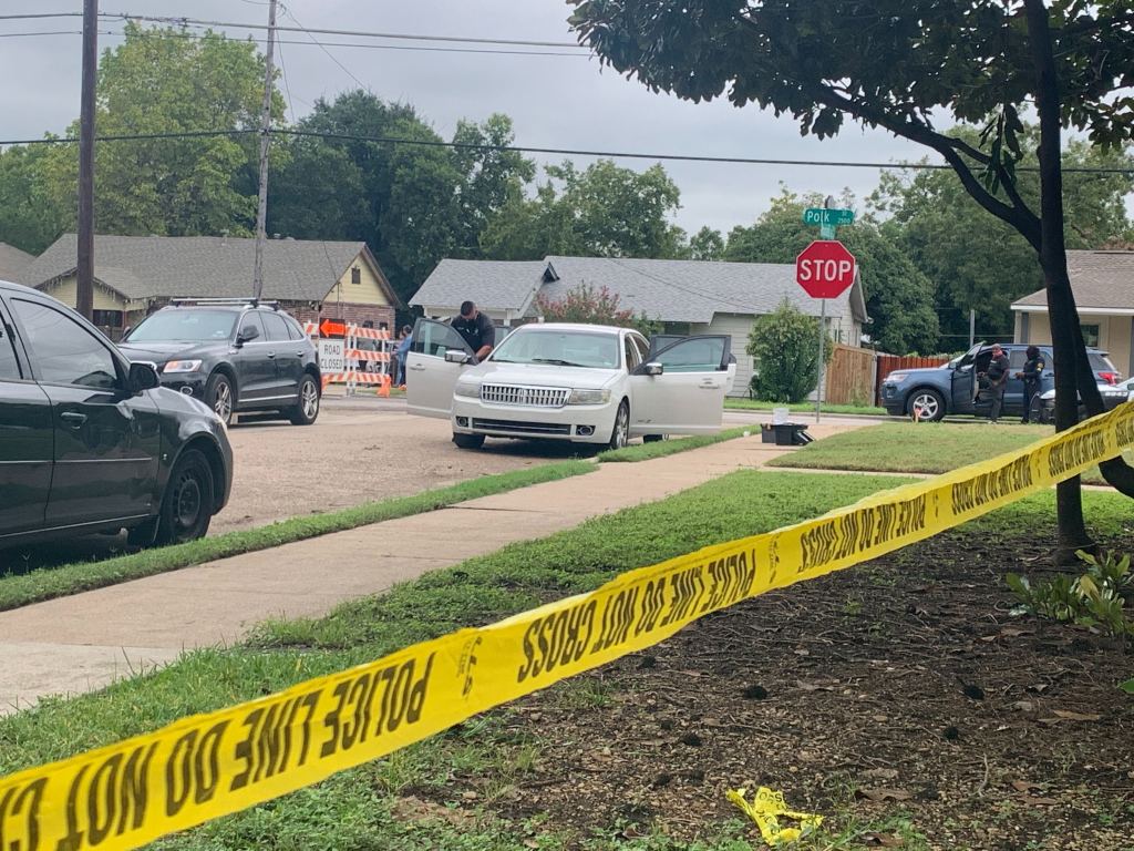 Police crime scene tape surrounds the car that was reported stolen early Wednesday morning with a 3-year-old girl inside, who was later found safe by officers.