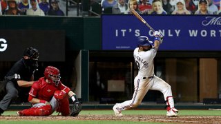 Isiah Kiner-Falefa #9 of the Texas Rangers hits a single against the Los Angeles Angels in the bottom of the fifth inning at Globe Life Field on Sept. 9, 2020 in Arlington, Texas.