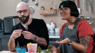 Andrew Rea, founder of the Binging with Babish network, left, tastes a beet parsnip licorice created by chef Sohla El-Waylly