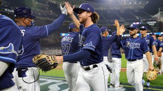 Brett Phillips #14 of the Tampa Bay Rays celebrates with teammates after the Rays defeated the New York Yankees in Game 2 of the ALDS at Petco Park on Tuesday, Oct. 6, 2020 in San Diego, California.