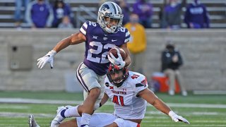 Running back Deuce Vaughn #22 of the Kansas State Wildcats rushes past linebacker Jacob Morgenstern #41 of the Texas Tech Red Raiders, after catching a pass for a touchdown during the second half at Bill Snyder Family Football Stadium on Oct. 3, 2020 in Manhattan, Kansas.