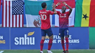 Fafa Picault #9 of FC Dallas celebrates with his teammate Andrés Ricaurte #10 after scoring a goal during the MLS game between Houston Dynamo and FC Dallas at Toyota Stadium on Oct. 31, 2020 in Frisco, Texas.