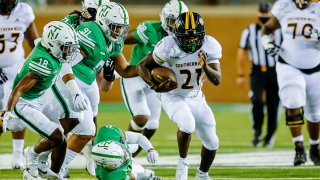 Southern Miss Golden Eagles running back Frank Gore Jr. (21) breaks through the line of scrimmage during the game between the North Texas Mean Green and the Southern Miss Golden Eagles on Oct. 3, 2020 at Apogee Stadium in Denton, Texas.