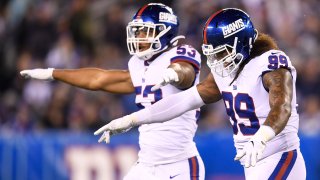 EAST RUTHERFORD, NEW JERSEY – NOVEMBER 04: Leonard Williams #99 and Oshane Ximines #53 of the New York Giants react during the second quarter of the game against the Dallas Cowboys at MetLife Stadium on November 04, 2019 in East Rutherford, New Jersey. (Photo by Sarah Stier/Getty Images)