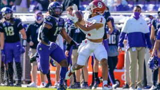 Oklahoma Sooners running back Seth McGowan (1) catches a pass for a first down over TCU Horned Frogs linebacker Dee Winters (13) during the game between the TCU Horned Frogs and the Oklahoma Sooners on October 24, 2020 at Amon G. Carter Stadium in Fort Worth, Texas.