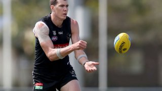Mason Cox of the Magpies makes a handpass during a Collingwood Magpies AFL training session at Maroochydore Multi Sports Complex on September 02, 2020 in Sunshine Coast, Australia.