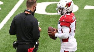 Kyler Murray #1 of the Arizona Cardinals talks to head coach Kliff Kingsbury during the game against the New York Jets at MetLife Stadium on October 11, 2020 in East Rutherford, New Jersey. Arizona Cardinals defeated the New York Jets 30-10.