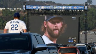 A fan watches the Dodgers game at Dodger Stadium.