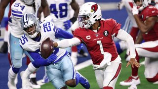 Kyler Murray #1 of the Arizona Cardinals runs for a touchdown against Xavier Woods #25 of the Dallas Cowboys during the third quarter at AT&T Stadium on Oct. 19, 2020, in Arlington, Texas.