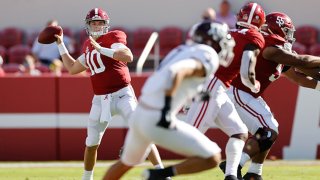 Mac Jones #10 of the Alabama Crimson Tide looks upfield for a receiver against the Texas A&M Aggies on Oct. 3, 2020 at Bryant-Denny Stadium in Tuscaloosa, Alabama.