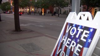 Voters expecting to cast their ballots on the first day of early voting were greeted by long lines in many places across North Texas, including the American Airlines Center in downtown Dallas.