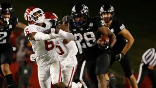 Running back Breece Hall #28 of the Iowa State Cyclones drives the ball past defensive back Tre Brown #6 of the Oklahoma Sooners in the second half of the play at Jack Trice Stadium on Oct. 3, 2020 in Ames, Iowa. The Iowa State Cyclones won 37-30 over the Oklahoma Sooners.