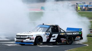 Sheldon Creed, driver of the #2 Chevy Truck Month Chevrolet, celebrates with a burnout after winning the NASCAR Gander RV & Outdoors Truck Series SpeedyCash.com 400 at Texas Motor Speedway on Oct. 25, 2020 in Fort Worth, Texas.