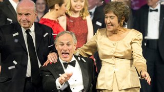 FILE -- Texas Gov. Greg Abbott celebrates his inauguration as the 48th Governor of Texas onstage at the 2015 Texas Inaugural Ball with his mother-in-law, Mary Lucy Phalen, and father-in-law from San Antonio.