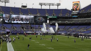 The Baltimore Ravens head onto the field before the game against the Tennessee Titans at M&T Bank Stadium on Nov. 22, 2020 in Baltimore, Maryland.
