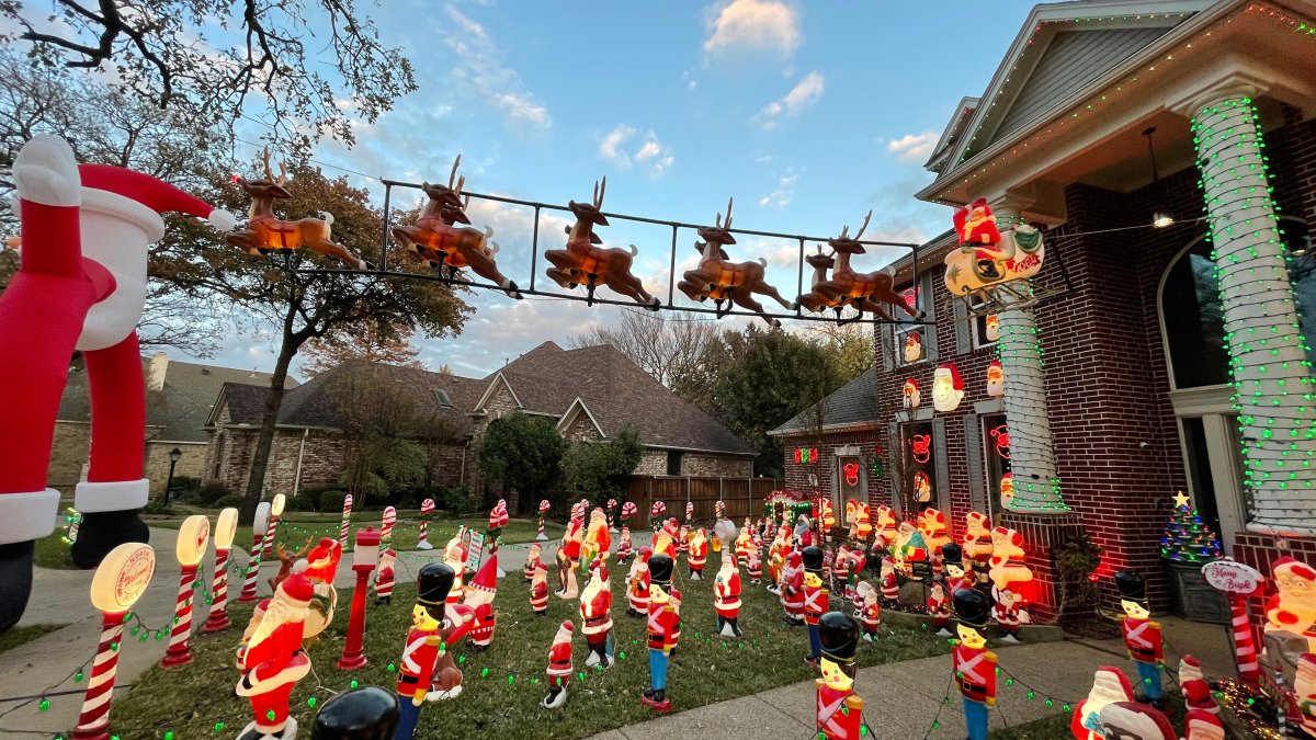 Grapevine Family Displays Hundreds of Santa Decorations in Front Yard