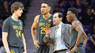 Head coach Scott Drew of the Baylor Bears talks with players Devonte Bandoo #2, Tristan Clark #25 and Matthew Mayer #24, during the first half against the Kansas State Wildcats at Bramlage Coliseum on Feb. 3, 2020 in Manhattan, Kansas.