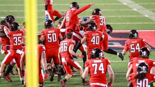 The Texas Tech Red Raiders celebrate on the field after the game winning field goal by kicker Jonathan Garibay #46 after the college football game against the Baylor Bears at Jones AT&T Stadium on Nov. 14, 2020 in Lubbock, Texas.