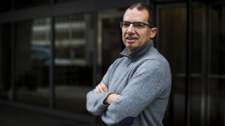 In this Nov. 14, 2017, file photo, Stephane Bancel, chief executive officer of Moderna Therapeutics Inc., stands for a photograph at the company’s office in Cambridge, Massachusetts.