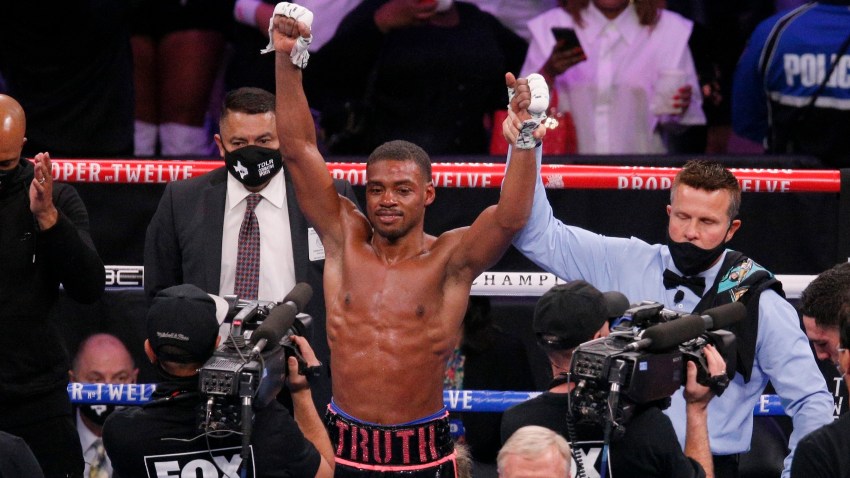 Errol Spence Jr. celebrates after defeating Danny Garcia by unanimous decision in the WBC-IBF welterweight boxing bout in Arlington, Texas, Saturday, Dec. 5, 2020. (AP Photo/Brandon Wade)