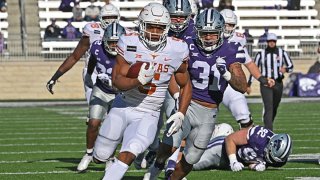 Running back Bijan Robinson #5 of the Texas Longhorns rushes for a touchdown against the Kansas State Wildcats during the first half at Bill Snyder Family Football Stadium on Dec. 5, 2020 in Manhattan, Kansas.